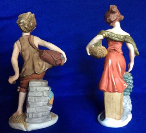 Pair of Leonardo Collection Bisque Porcelain Figurines