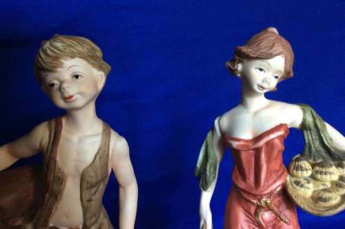 Pair of Leonardo Collection Bisque Porcelain Figurines