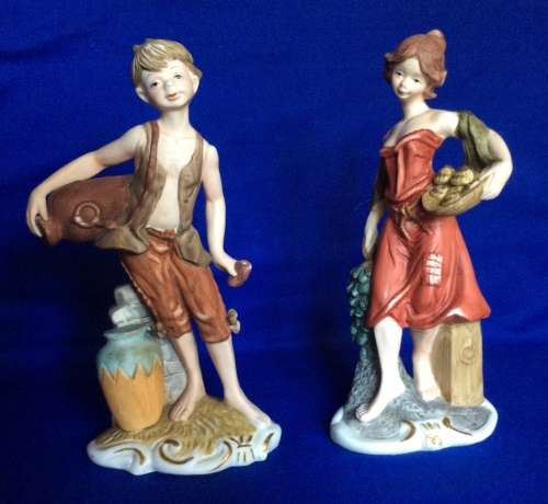 Pair of Leonardo Collection Bisque Porcelain Figurines