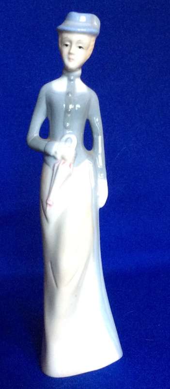 Set of Three Porcelain Figurines in Pastel Tones