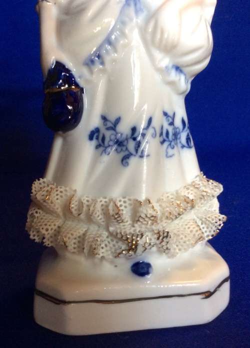 Matching Pair of Blue and White Porcelain Figurines