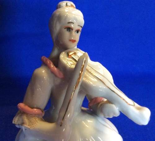 Matching Pair of Small Porcelain Musician figurines