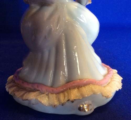 Matching Pair of Small Porcelain Musician figurines