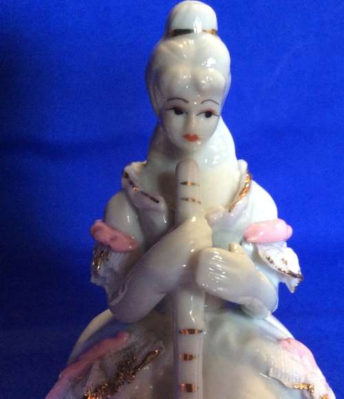 Matching Pair of Small Porcelain Musician figurines