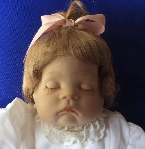 Sleeping Baby Porcelain Doll on Heart Shaped Pillow