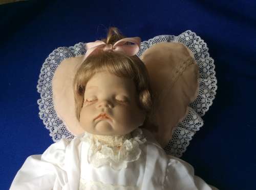 Sleeping Baby Porcelain Doll on Heart Shaped Pillow