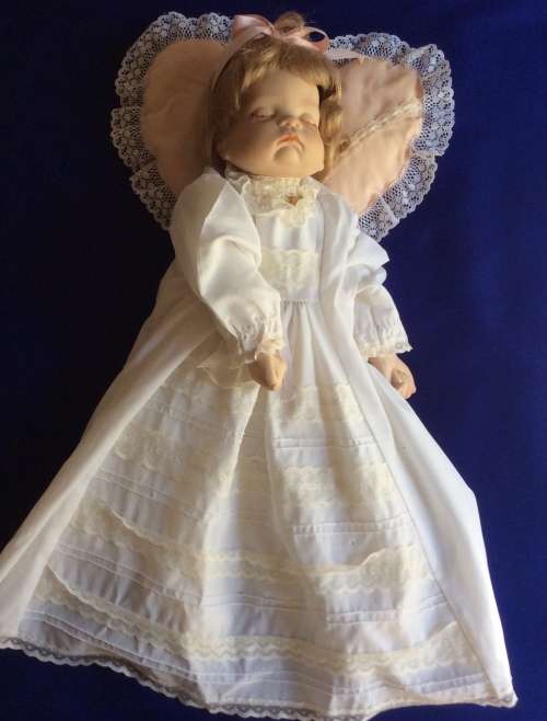 Sleeping Baby Porcelain Doll on Heart Shaped Pillow