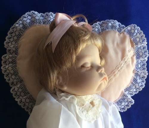 Sleeping Baby Porcelain Doll on Heart Shaped Pillow