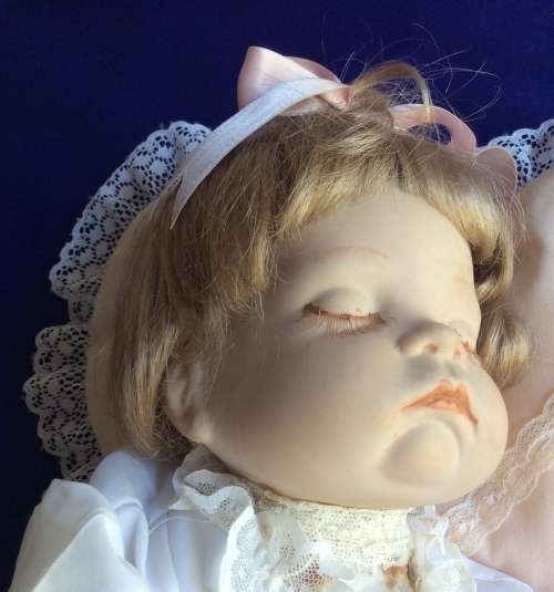 Sleeping Baby Porcelain Doll on Heart Shaped Pillow