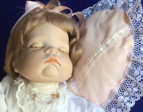 Sleeping Baby Porcelain Doll on Heart Shaped Pillow