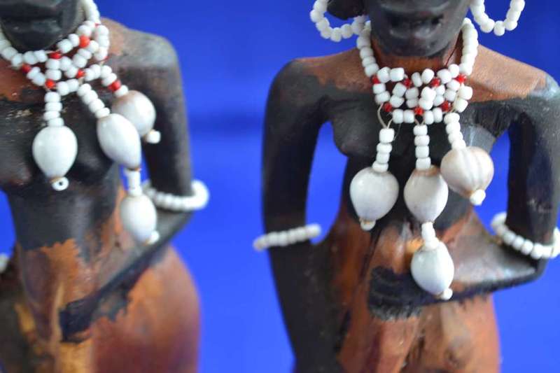 Traditional Masai Carved Wooden Figures and Miniature Hide Shield