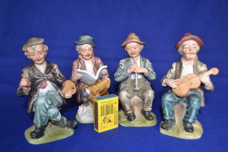 Set of Four Bisque Porcelain Figures