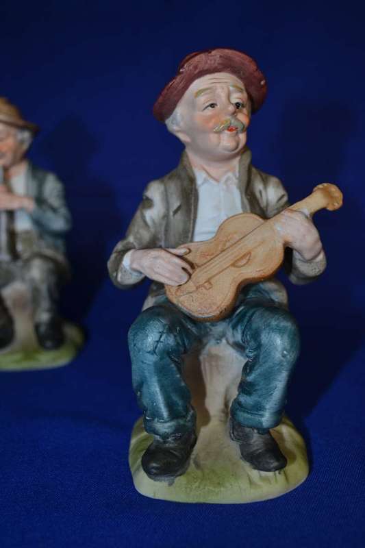 Set of Four Bisque Porcelain Figures