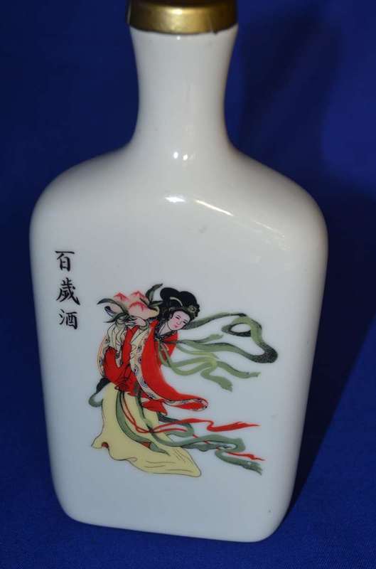 Carved Wooden Chinese Figure with Taiwan Tobacco & Wine Bottle