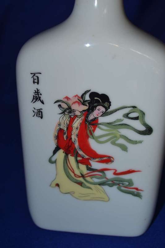 Carved Wooden Chinese Figure with Taiwan Tobacco & Wine Bottle