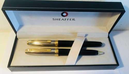 SHEAFFER SAGARIS ROLLERBALL PEN AND BALLPOINT PEN, BLACK AND SILVER BARREL WITH GOLD TRIM IN BOX
