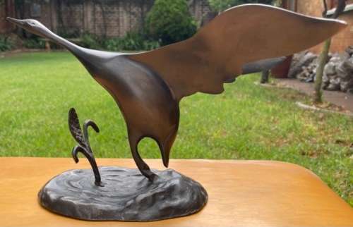 DESK TOP SIZE BRONZE SCULPTURE, BIRD TAKING OFF FROM GROUND BY UNKNOWN ARTIST