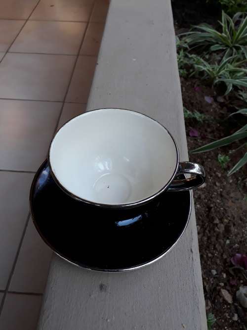 RENOWNED CERAMICS ARTIST PETER MTHOMBENI SIGNED TEA CUP & SAUCER BLACK WITH CHROME RIMS. WOW!