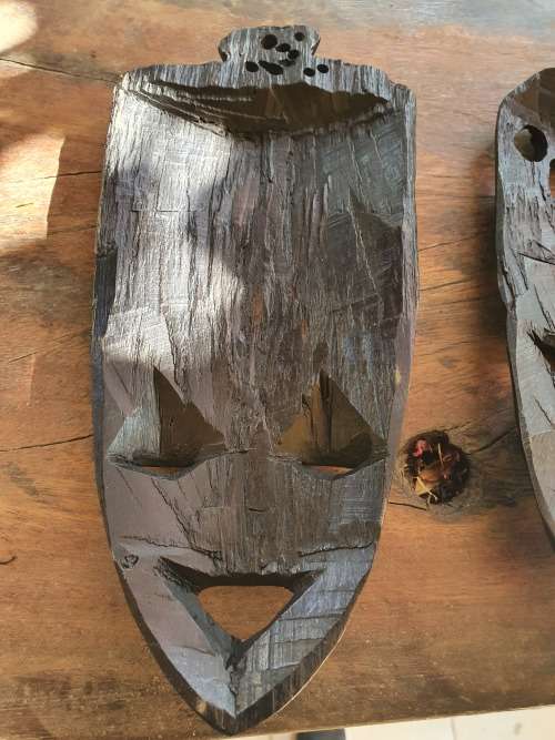 A PAIR OF EBONTY??? WOOD CARVED SMALL MASKS WITH FACE, GIRAFFE AND ELEPHANT