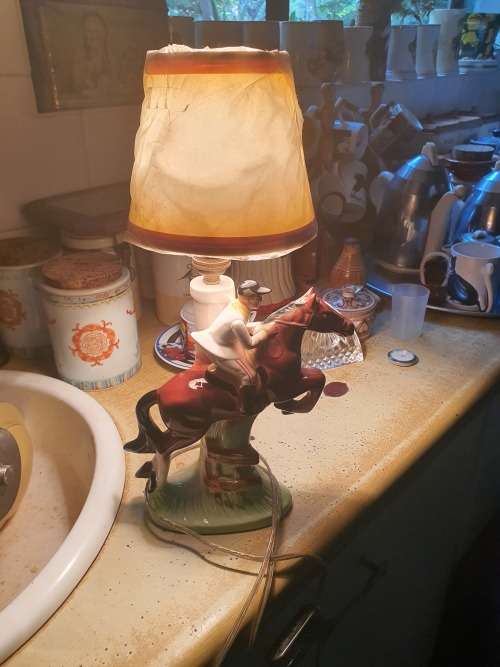 Very cute ceramic horse and rider lamp base plus shade working