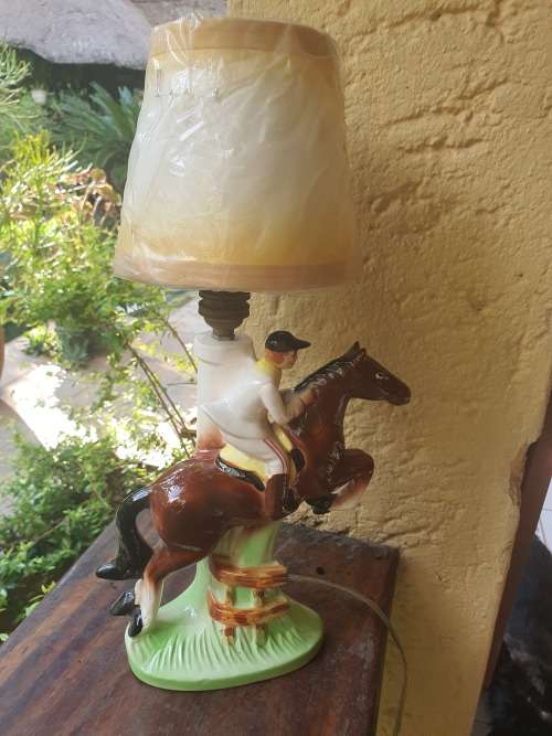 Very cute ceramic horse and rider lamp base plus shade working