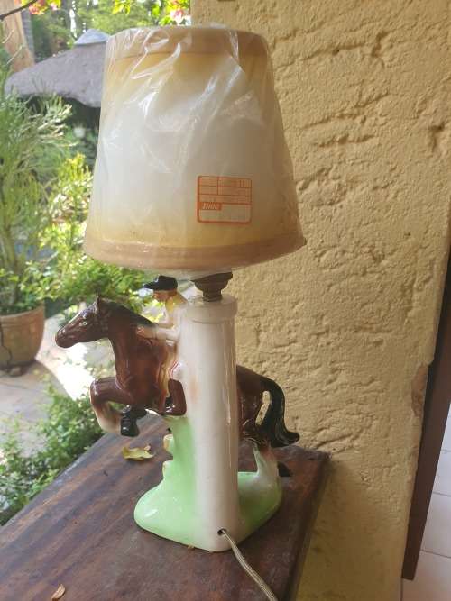 Very cute ceramic horse and rider lamp base plus shade working