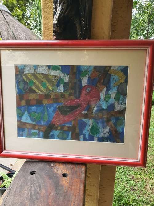 Vintage and colourful framed art work by a child of a bird