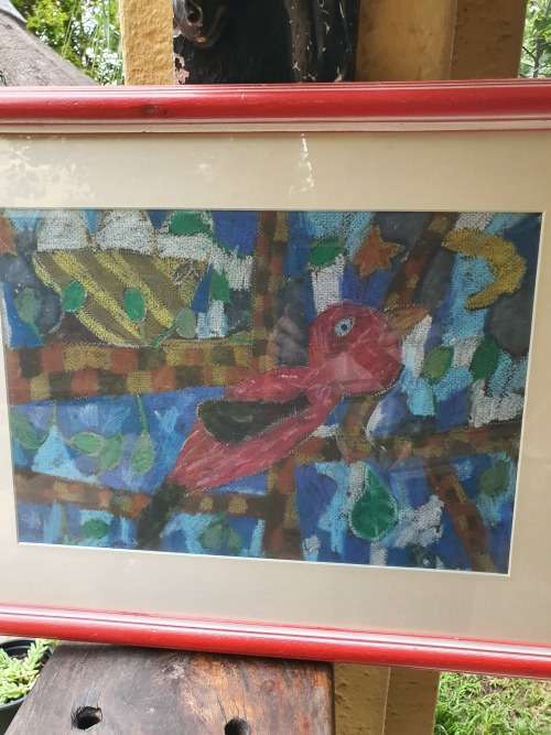 Vintage and colourful framed art work by a child of a bird