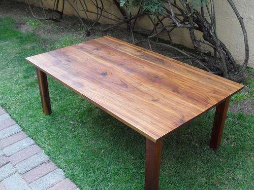 VERY HEAVY COFFEE TABLE MADE OF WHAT I BELIEVE IS SOLID KIAT WOOD. IT IS MAGNIFICENT!