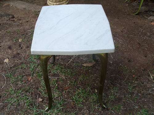 FAUX MARBLE SIDE TABLE WITH CASTE BASE/LEGS THAT ARE BRASS COLOURED.