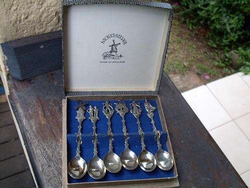 NICKEL SILVER MADE IN HOLLAND VINTAGE BOXED SET OF TEASPOONS DEPICTING VARIOUS SCENES