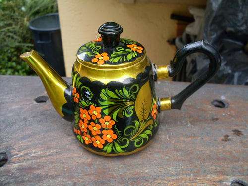 THIS IS CUTE. HAND PAINTED WITH FLOWERS SMALL ALUMINIUM TEAPOT. PRETTY PIECE FOR THE COLLECTOR