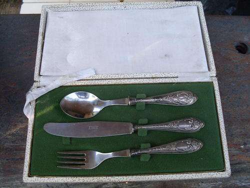 MARKED (DIFFICULT TO MAKE OUT)  800 SILVER HANDLED BOXED ORNATE 3 PIECE CHRISTENING SET