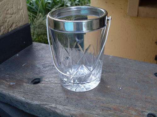 LEAD CRYSTAL ICE BUCKET WITH SILVER PLATED RIM & HANDLE. DIAMAND TYPE SHAPE WITH LOGO