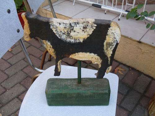 LARGE RATHER NICE RUSTIC PAINTED COW ORNAMENT ON STAND