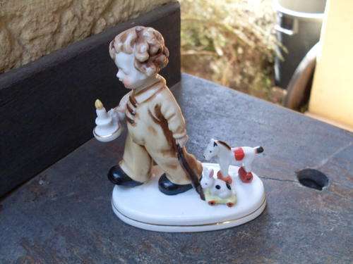 LOVELY "HUMMEL" LIKE ORNAMENT OF A BOY & TOY RABBIT & DONKEY. CUTE PIECE!