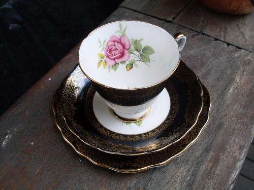 OFFER HAN3TRAVEL ONLY  IMPERIAL  CHINA TEA TRIO  BLACK, WITH 22KT GOLD FILIGREE TYPE PATTERN & ROSES