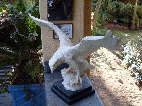 WHAT I KNOW AS BONDED MARBLE LARGE SIGNED SPREAD WINGED EAGLE ON A PLINTH. GREAT PIECE