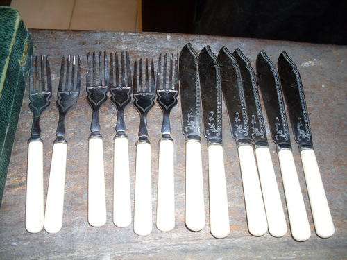 LOVELY SILVER CHROME PLATED SET OF SIX FISH KNIVES AND FORKS IVORINE HANDLES . LOVELY PATTERN