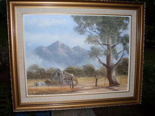 REDUCED!! FRAMED AND SIGNED SA ARTIST HENNIE COETZEE RURAL COTTAGE, MOUNTAIN & CLOUDS SCENE ON BOARD