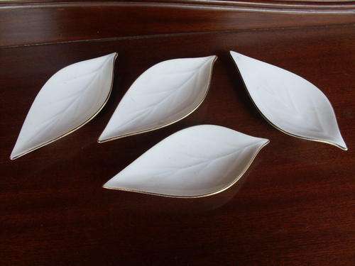 ALKA BAVARIA SET OF FOUR WHITE LEAF SHAPED NUT / PIN  DISHES WITH GILT TRIM