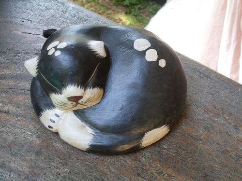 A SLEEPING BEAUTY  BLACK AND WHITE KITTY (CAT) WOOD ORNAMENT
