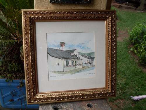 NO 2 OF A BEAUTIFULLY FRAMED WATERCOLOUR OF MAIN ST. HERMANUS CAPE BY CAROLINE BARLOW 1996