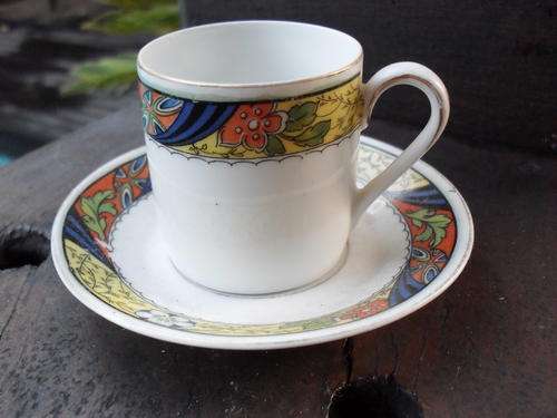 DEMI TASSE B G BAVARIA CUP AND SAUCER. YELLOW/BLUE ORANGE COLOURS IN FLORAL & LEAF ATTERN