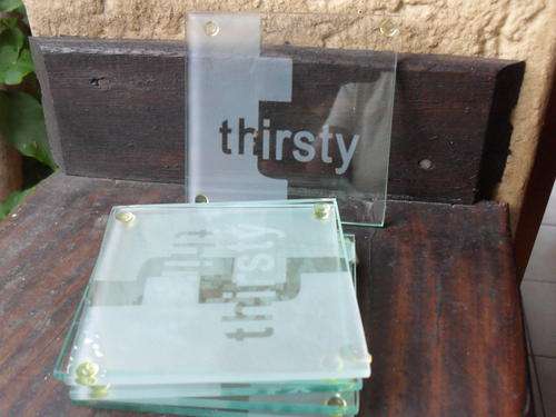 SET OF SIX "THIRSTY" GLASS COASTERS  WITH PATTERN