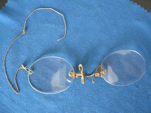 1920's reading glasses on gold chain. Nose clips are spring-loaded in original case.