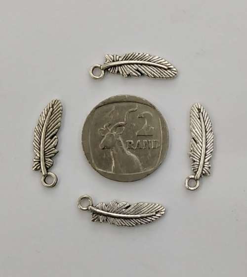 10 x Silver Feather Charms, detail on both sides. 23mm x 7mm, hole 2mm.