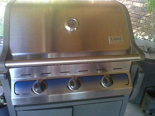 CADAC Three burner patio braai with side tables and doors.