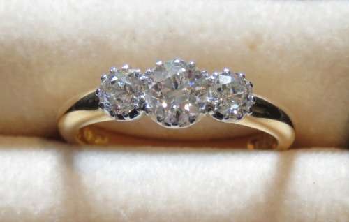 18CT GOLD DRESS RING set with THREE DIAMONDS
