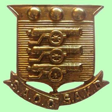 S.A.D.F - ORDNANCE CORPS CAP BADGE WITH LOOPS.